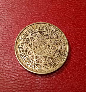 Fine Morroco Coin: Translates to 1951. The date corresponds to an event in the life of the prophet Muhammad forward. Well struck brass coin. Fifty francs.