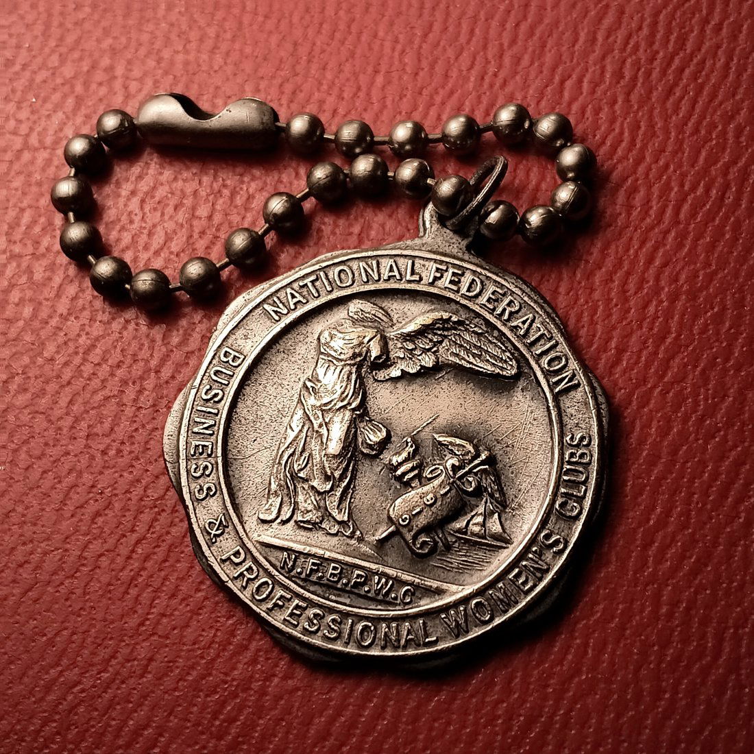 Vintage Women's Advocacy Medallion Keychain: Fine pewter. Strong, heavy cast.