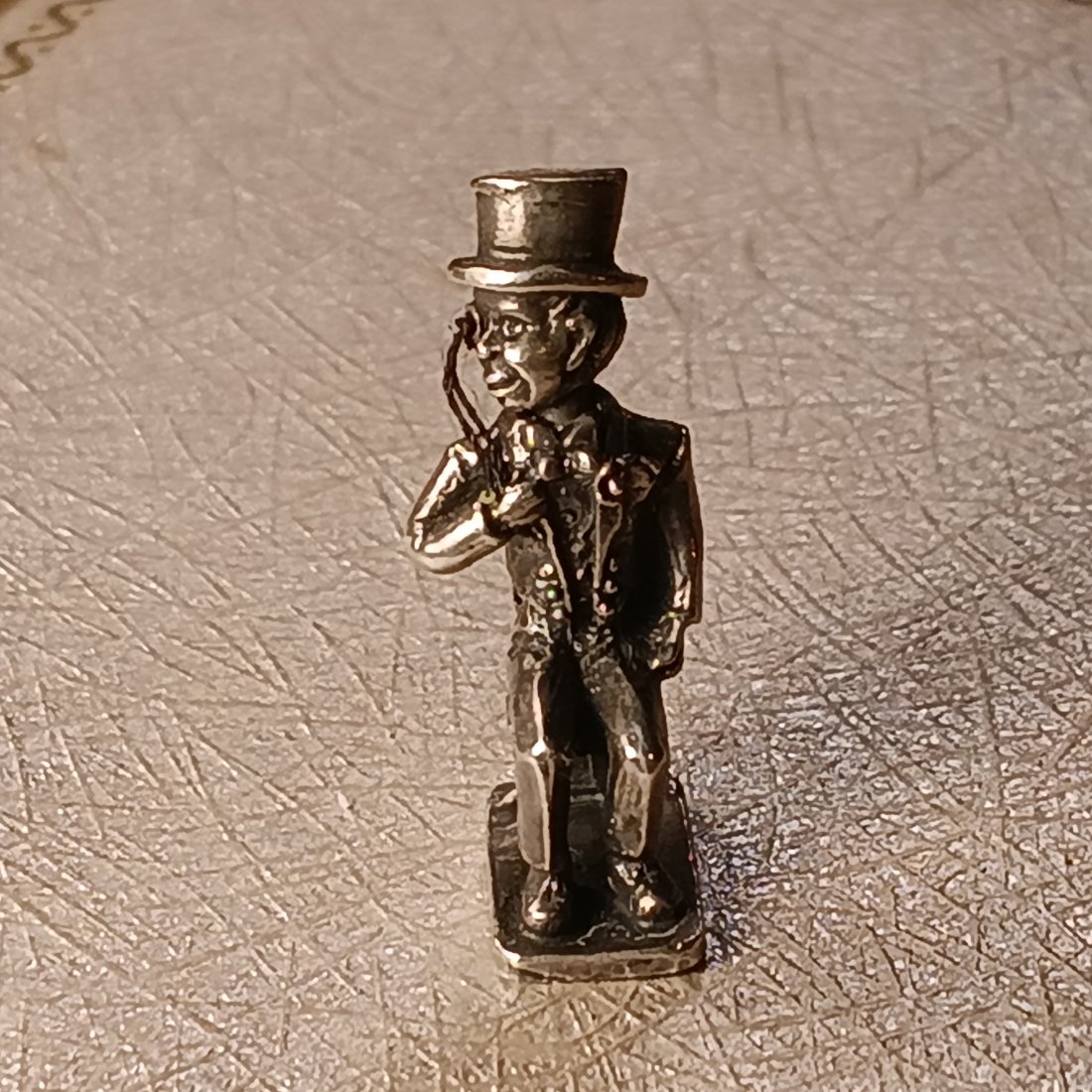 Vintage Silver Charm: Charlie McCarthy, dressed up, with monacle. Head swivels....not by itself.