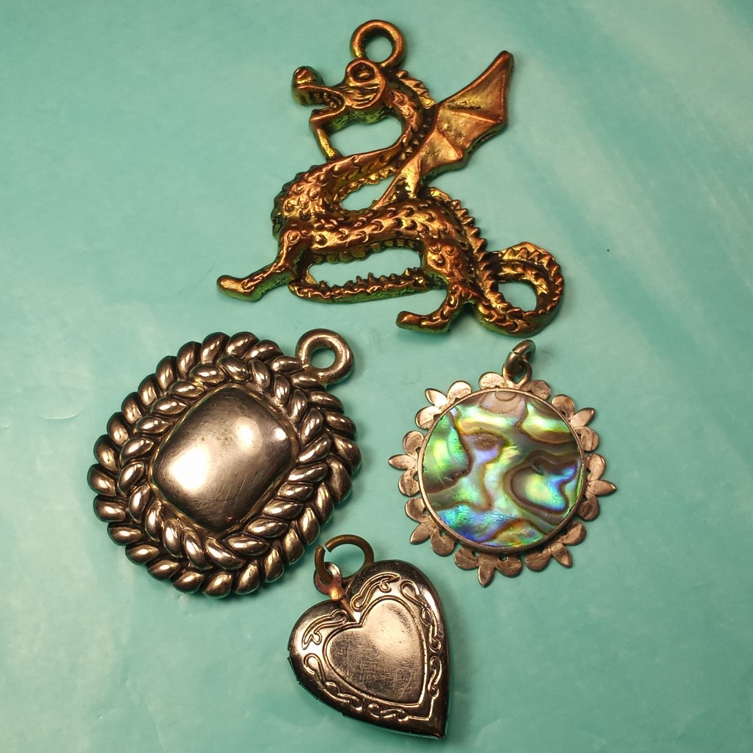Lot of Vintage Jewelry Elements: Good condition. Abalone and sterling silver pendant. Locket.