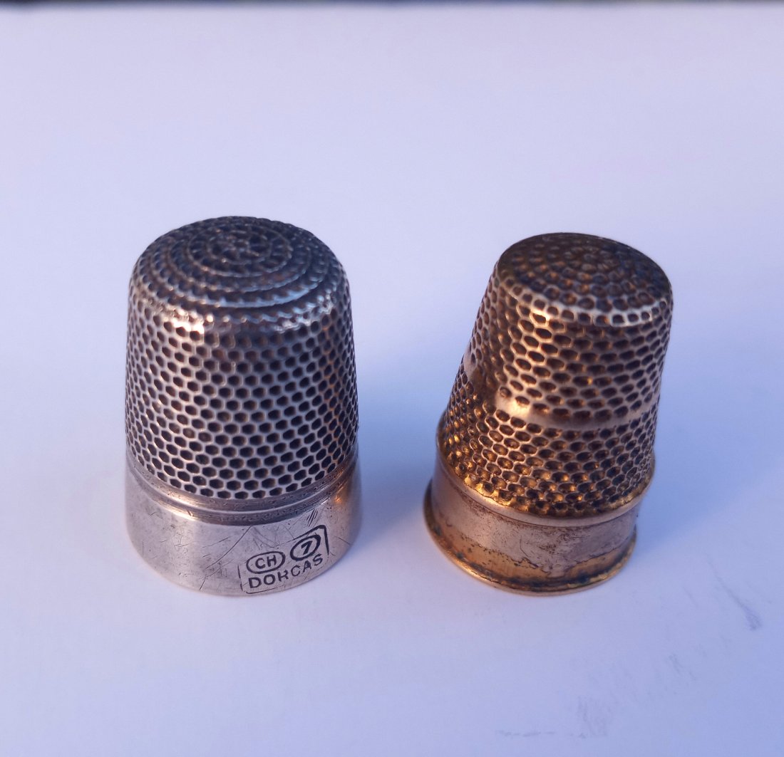 Pair Antique Thimbles Charles Horner: One is silver clad with the initials CH for Charles Horner. The other is gold plated, with most of gold worn. Both excellent working condition. Here is a link to info about Charles Horner: https://en.