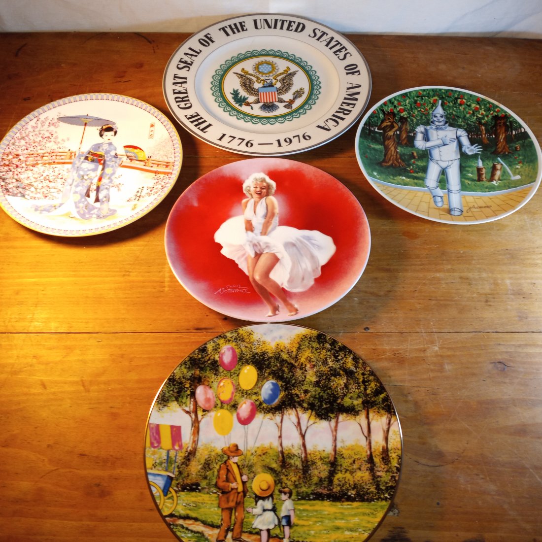 Lot of Five Collectable Plates Tin Man Balloon Man Marilyn: The Tin Man, the Japanese plate and the Balloon Man plates have original boxes with certificates of authenticity. The bicentennial charger has no bos. Also Marilyn has no box, but that is disputable. 