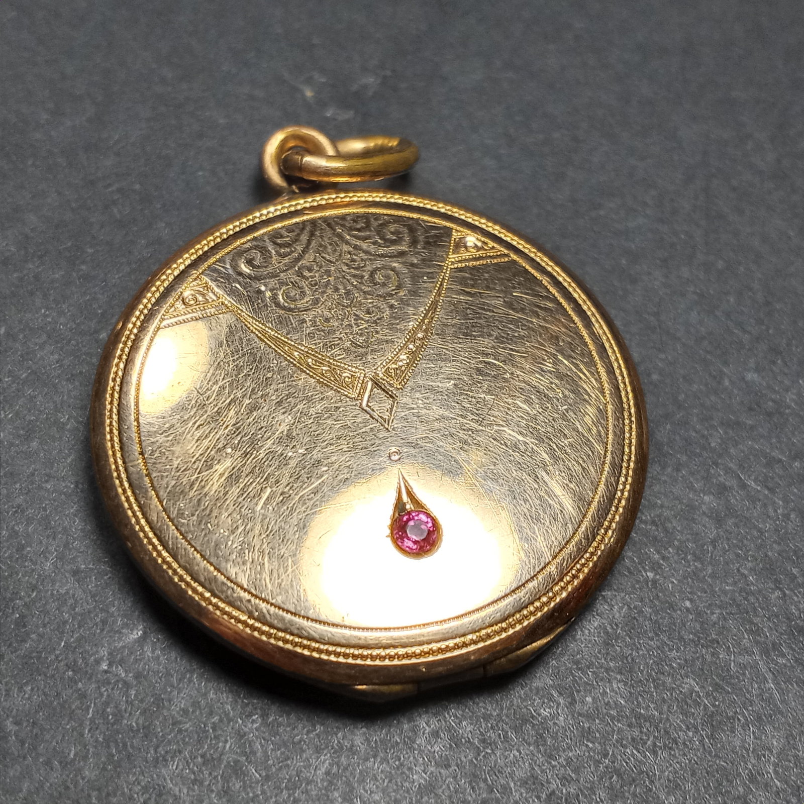 Beautiful Gold Plated Victorian Era Double Locket Pendant w/ Ruby or Spinel: Genuine antique period Victorian piece. Chasing. Probably between 1880 and 1900. Hinge is good. Some gold loss, dulling.