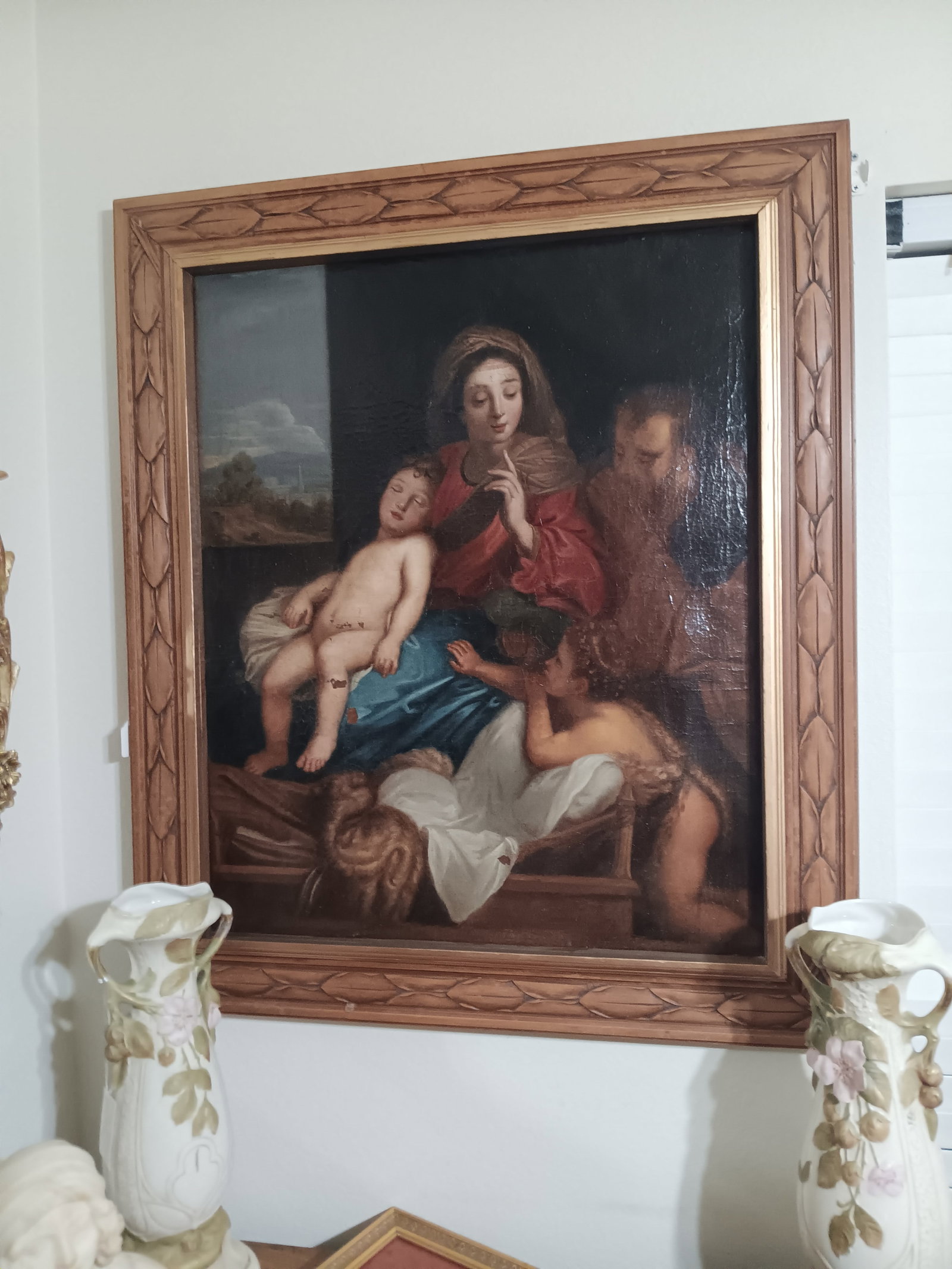 Large Antique Italian Holy Family Oil Painting: Beautiful painting. Has some small paint loss. Walnut carved frame.