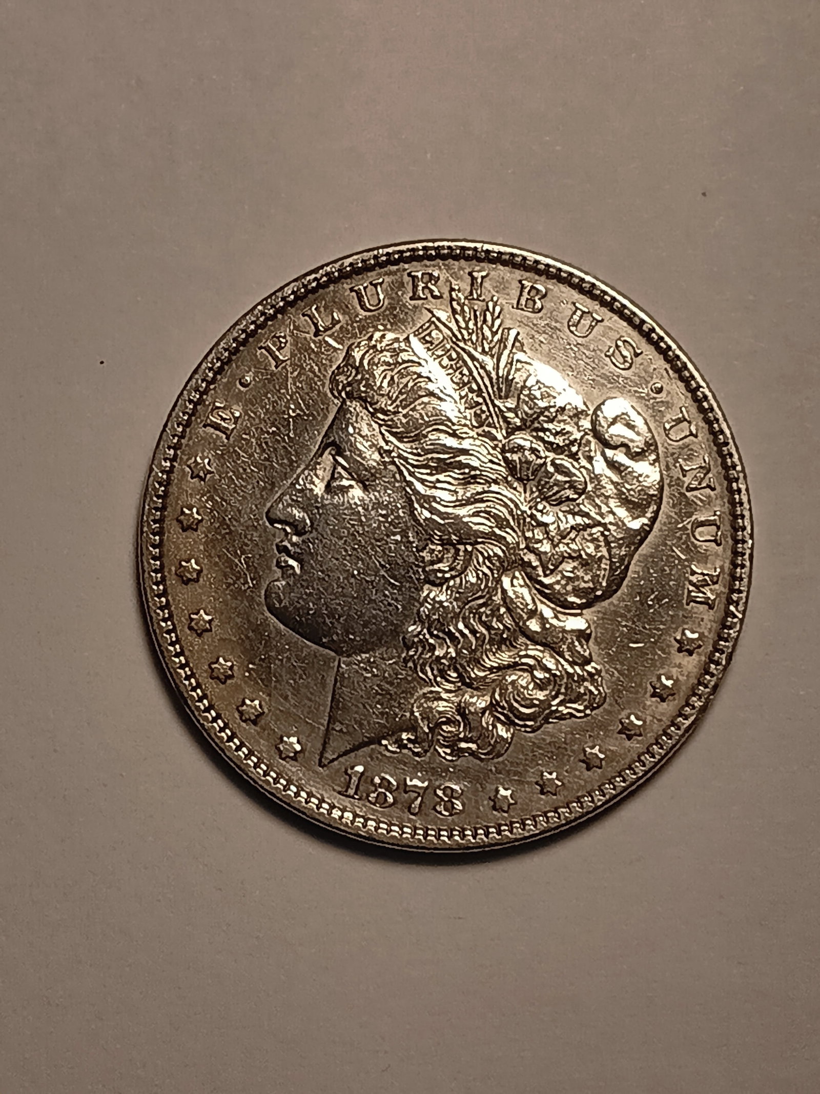 1878 Morgan Silver Dollar First Year of Morgan Dollar: 90% silver. First year of issue. Flat breasted variety.