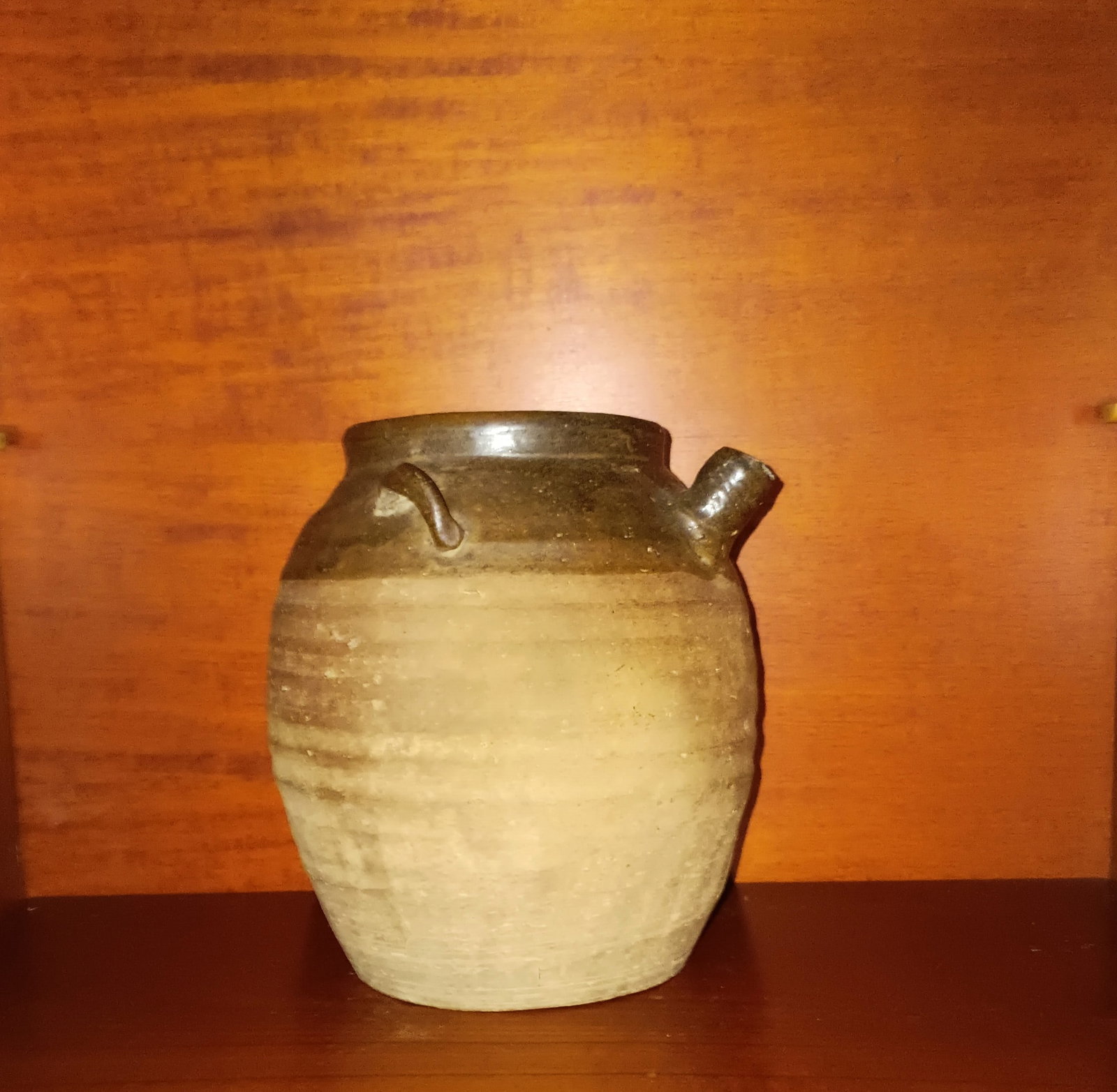 Vintage Thrown Pottery Little Brown Jug: Nothing broken. Don't know much. Seems to be quite an old piece. Obviously thrown. 6 1/2 inches tall by 6 1/2 wide. Google says it's a French jug, similar to a gargoyle jug. Some folks call it a kaise