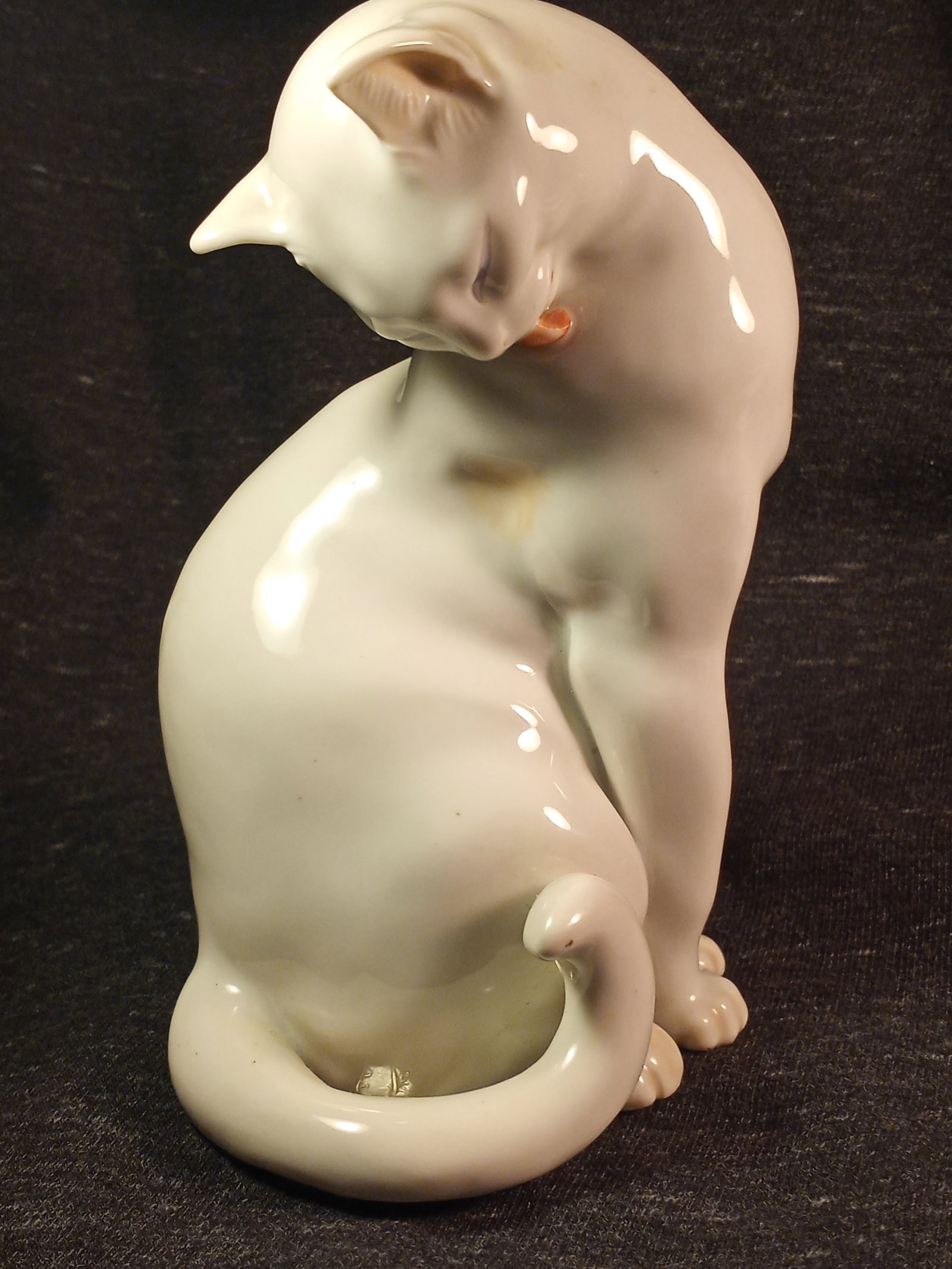 Very Fine Vintage Blanc de Chine Style Porcelain Cat Austria: A cat grooming its fur. Replete with guild marks underneath. Finest porcelain to be found.Many Much resemble Meissen work. German porcelain craftspeople emigrated from the Dresden/Meissen area after W