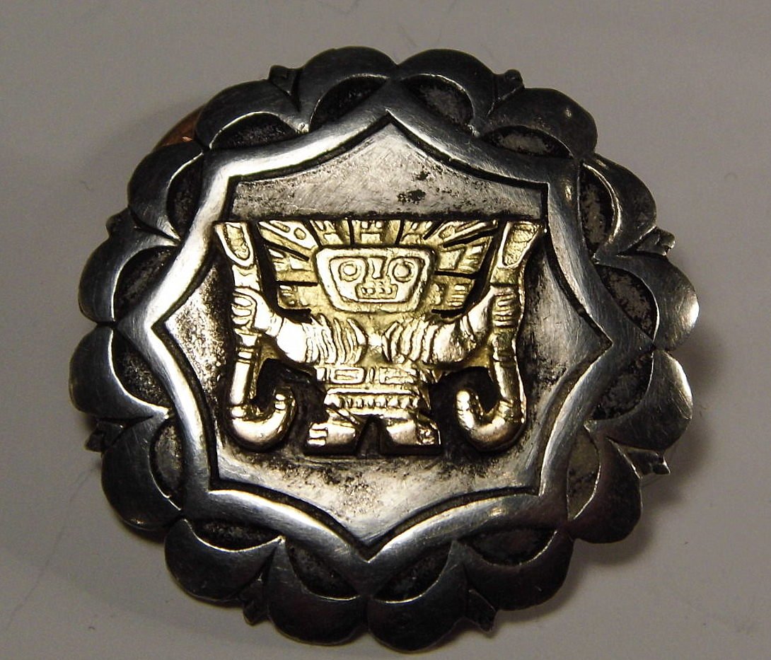 Native Peruvian Pin Sterling Silver & 18 Karat Gold: Ancient Incan form much resembles the Ancient Alien. Marked Peru, 925 and 18K. Measures about 1 1/2 inches.