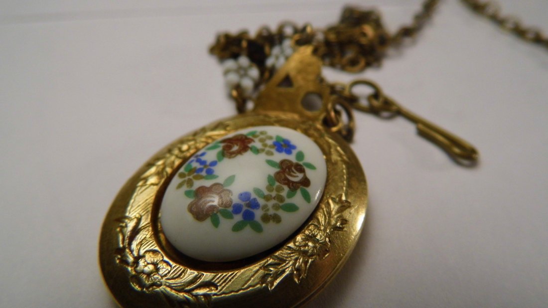 Victorian Hand Painted Porcelain Gold Filled Locket: Chain is 18.5 inches. No chips to porcelain cabochon or flowers. Locket snaps shut and release well.