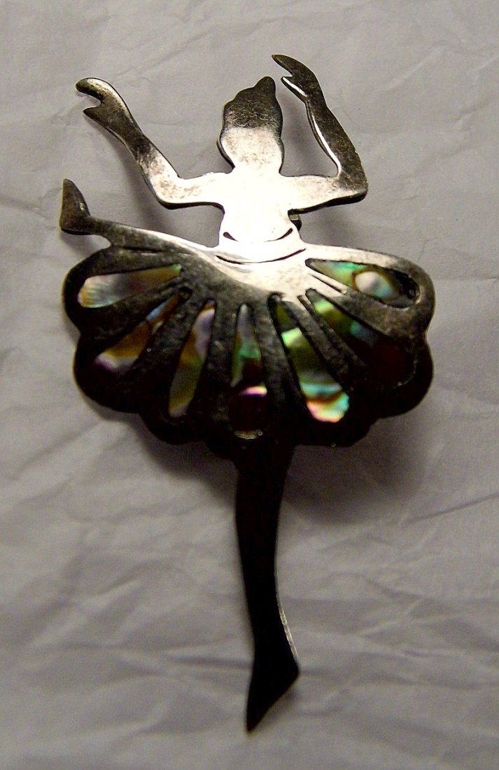 Sterling Silver Abalone Ballerina Pin Melicio Rodriguez: Art Deco of the 1930's influence. Taxco mark 3. Initials MR for Melicio Rodriguez, worked with Margot de Taxco. Measures 2 1/8 inches. Patina. No missing shell.