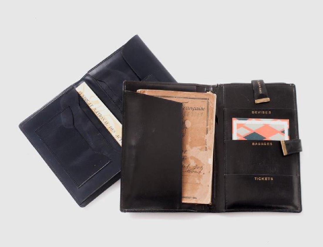 Black box case and documents at Yves Montand's names: Etui en box noir pour passeport, devises, bagages, tickets et chÃ©quier de la maison Lancel et un Ã©tui porte cartes en box noir Un portefeuille de maroquin estampÃ© aubergine au format in-8, in