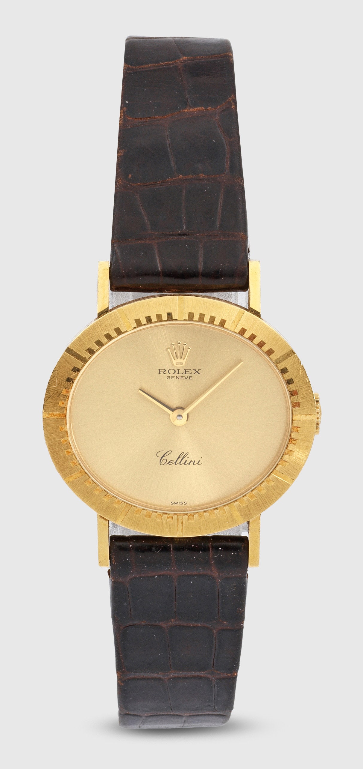 Damenarmbanduhr von Rolex-"Cellini" von 1991: Gelbgold, gest. 750. Querovales Uhrengehäuse, Lunette mit erhabenen Stabindexen, satiniertes Zifferblatt, Stabzeiger. Braunes, geprägtes Lederarmband mit Rolex-Gold-Dornenschließe. Mechanisches Wer