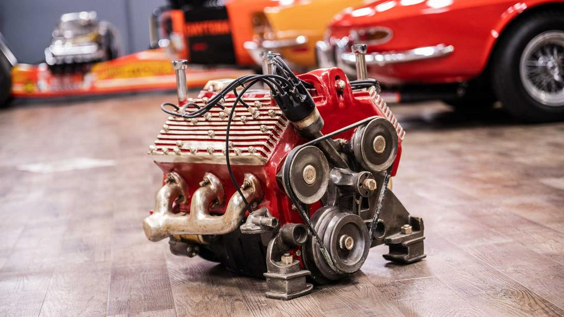 Ford Flathead V8 Model Engine Table Base: Lot G232 - Ford Flathead V8 Model Engine Table Base HIGHLIGHTS Ford Flathead V8 Model Engine Table Base Color(s): Red, Black, and Silver Dimensions (in): 26x22x23 Location: Gallery, South Floor