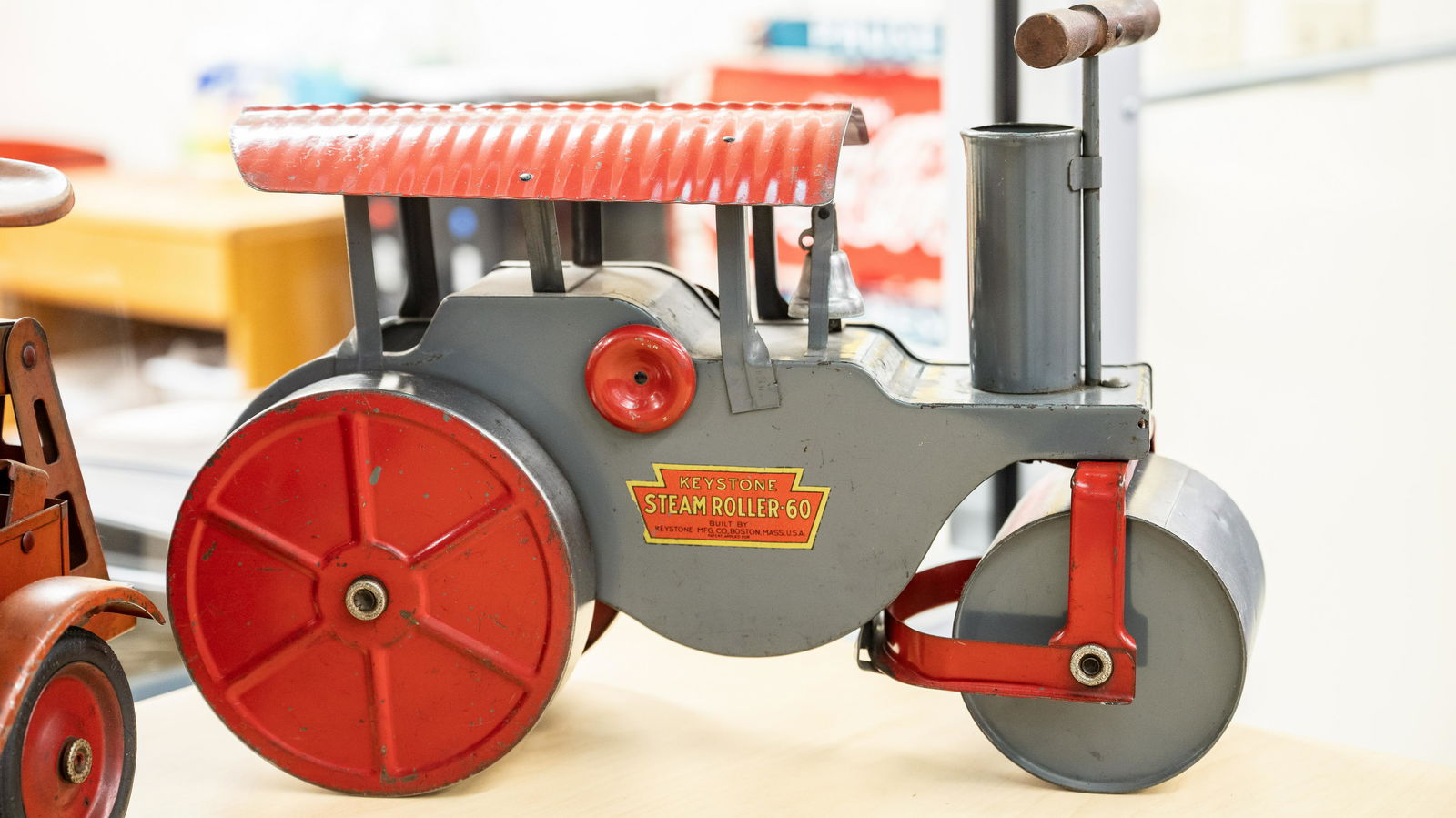 Keystone Steamroller-60 Tin Toy: Lot G193 - Keystone Steamroller-60 Tin Toy HIGHLIGHTS Original* Built by Keystone Mfg. Co., Boston, Mass., U.S.A. Dimensions (in): 19x14x9 Location: Office Break Room *A designation of "Original" mean