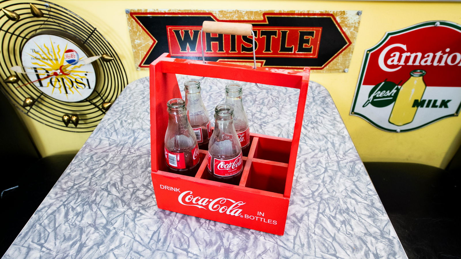 Coca-Cola Bottle Carrier: Lot T380 - Coca-Cola Bottle Carrier HIGHLIGHTS Wood Includes 4 bottles Drink Coca-Cola in Bottles Pause... Go Refreshed Color(s): Red and White Dimensions (in): 9x13x6 Location: Big Boy Diner