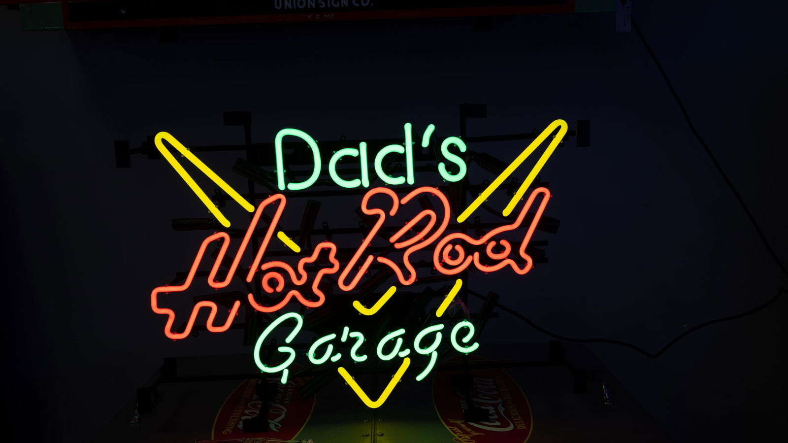 Dad’s Hot Rod Garage Single-Sided Neon Sign: Lot S534 - Dad’s Hot Rod Garage Single-Sided Neon Sign HIGHLIGHTS Neon Power Supply Model No. NG.A410EL Three Colors of Neon Dimensions (in): 27x17x6 Location: Bar Area