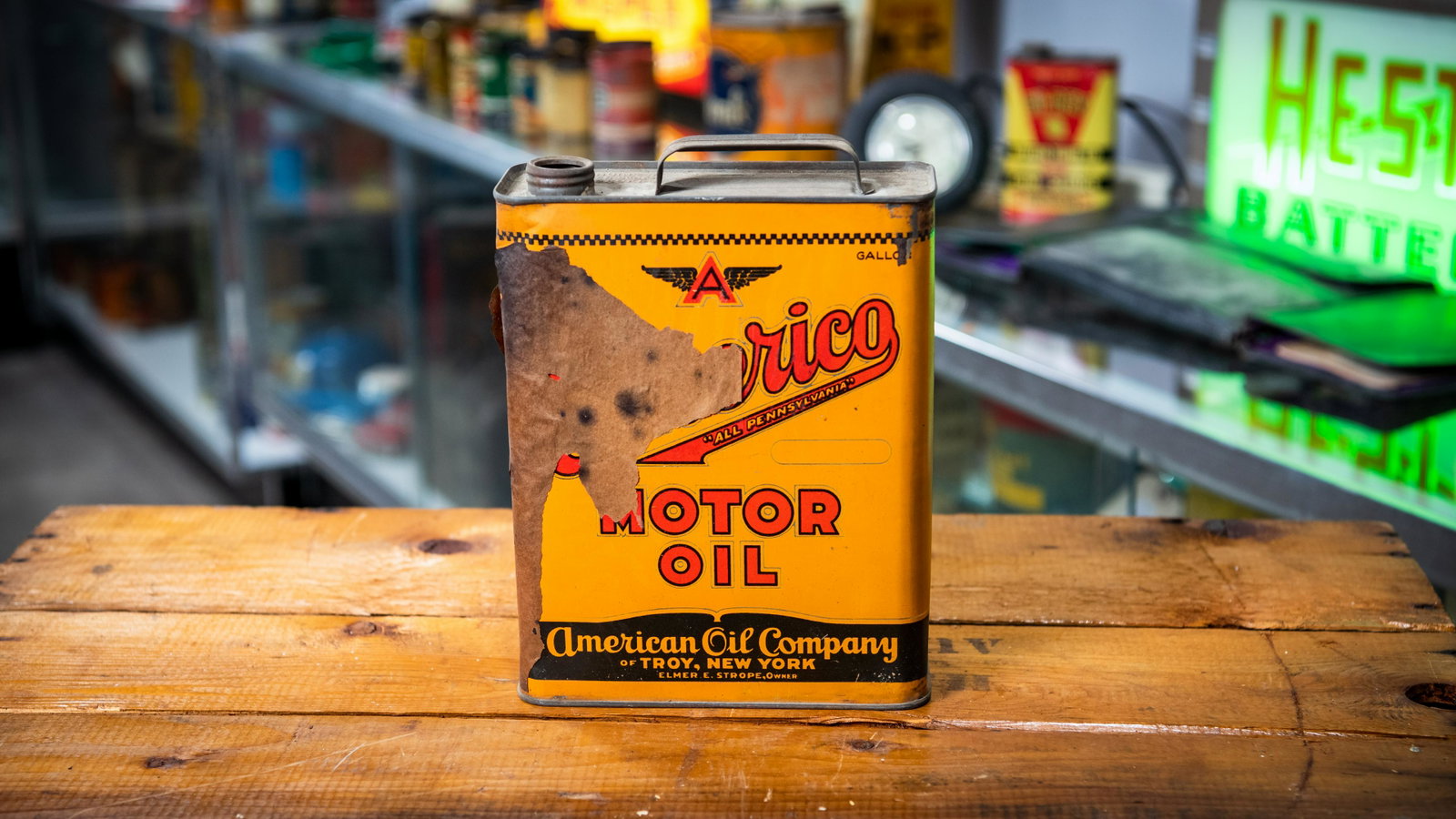 Americo Motor Oil 1-Gallon Oil Can: Lot U28 - Americo Motor Oil 1-Gallon Oil Can HIGHLIGHTS Original* American Oil Company, Troy, New York Elmer E Strope, Owner Location: Bowtie Room *A designation of "Original" means that this piece da