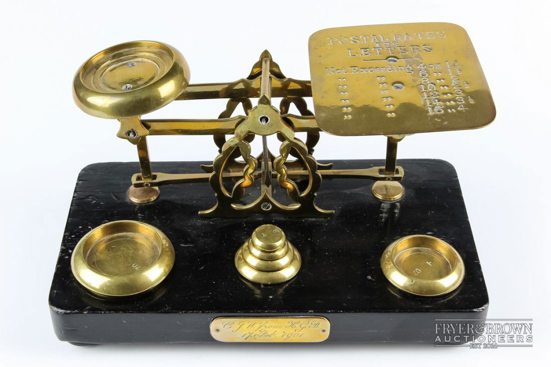 A set of brass and ebonised wood postal scales, with (1 of 3)