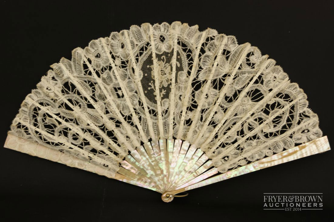A Victorian lace fan, with mother of pearl sticks and (1 of 6)