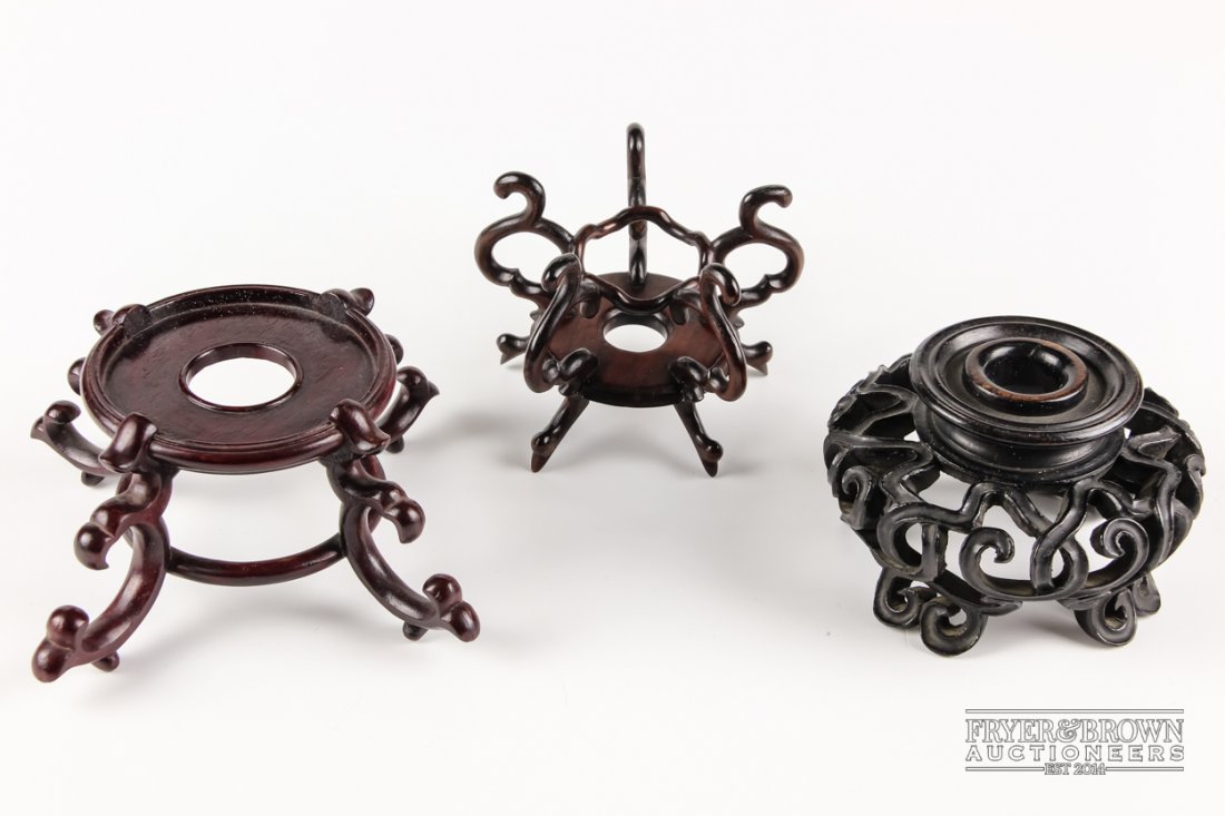 Three Chinese carved wood stands, each composed of (1 of 4)