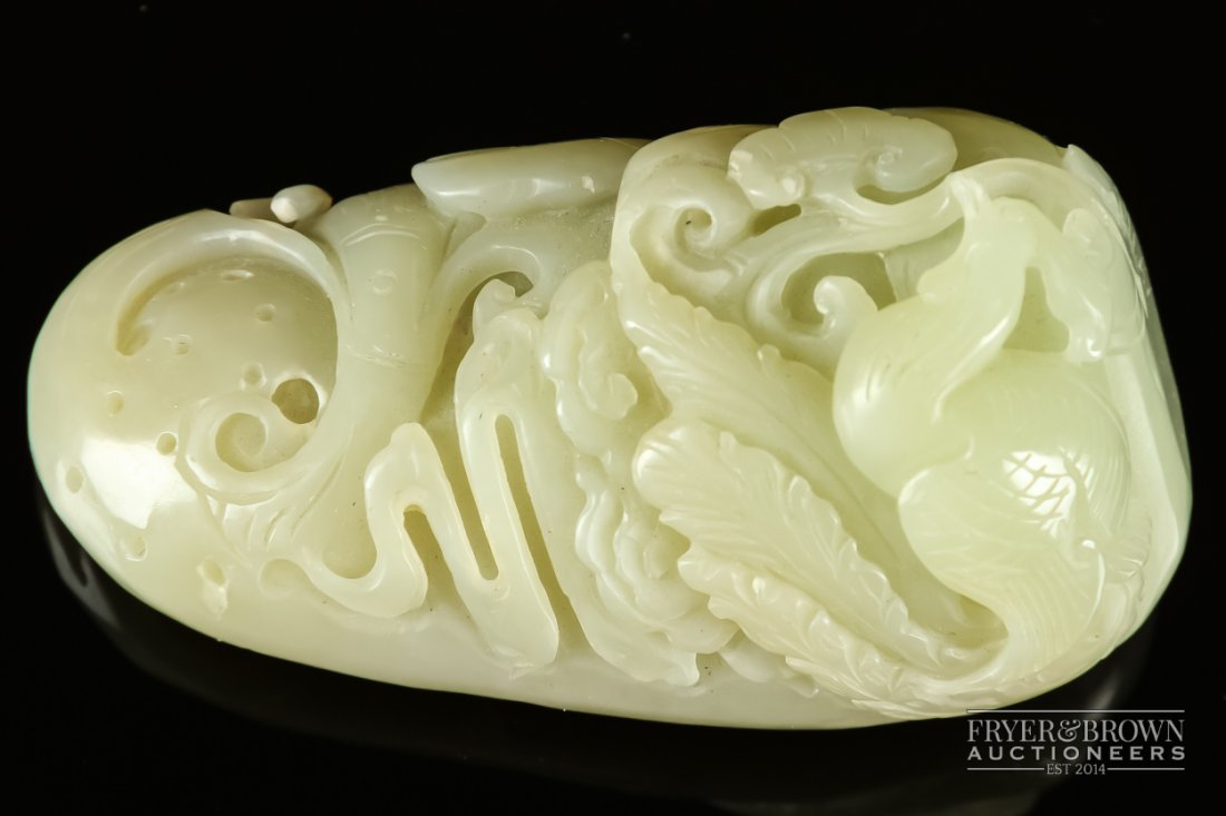 A Chinese mutton fat jade boulder carving, the small: A Chinese mutton fat jade boulder carving, the small boulder carved with a ho ho bird amongst lingzhi and scrolls, 8cm
