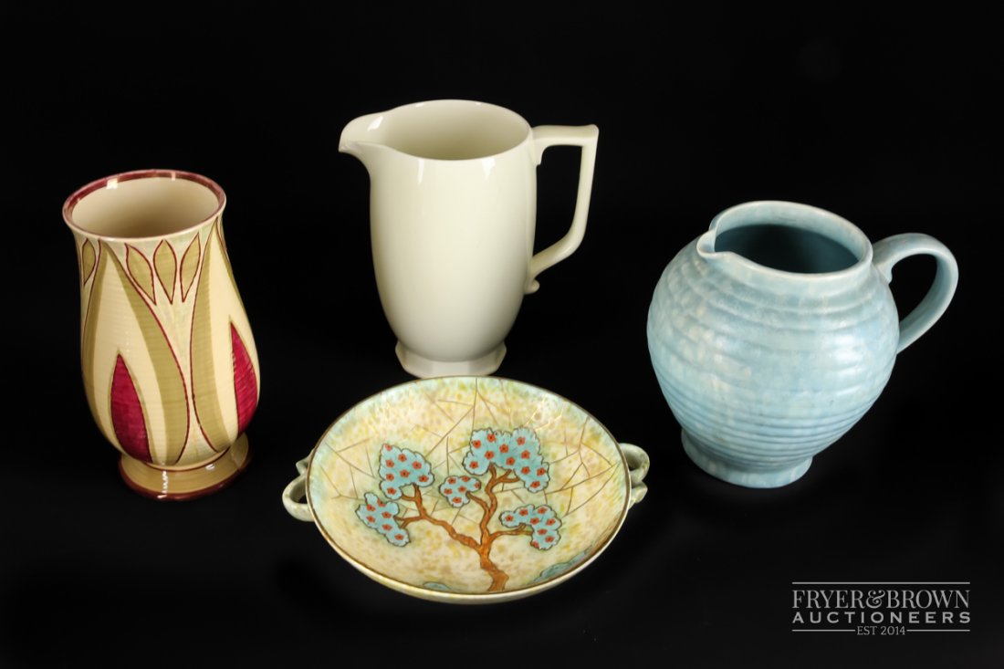 Keith Murray for Wedgwood - a large Queen's ware jug,: Keith Murray for Wedgwood - a large Queen's ware jug, on faceted foot, c1935-45, shape no. 3974, marked KM & Wedgwood to base, 22cm high approx; a Wade pottery vase; a Crown Devon two handled bowl; an