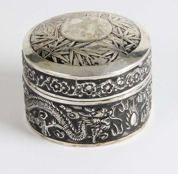 An antique Chinese silver box, c1870, the circular (1 of 3)