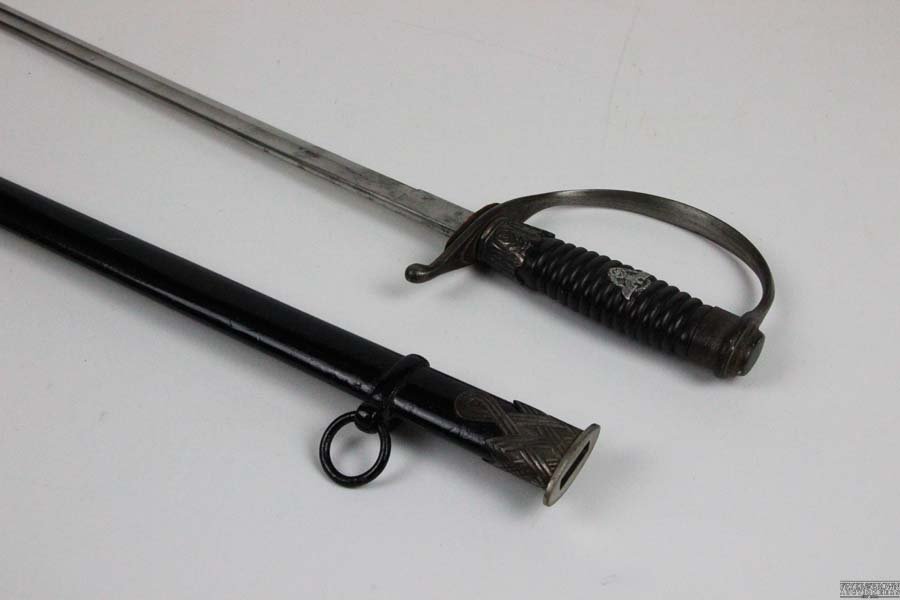 A German Nazi police N.C.O degen or straight sword,: A German Nazi police N.C.O degen or straight sword, with fine plain blade, makers mark Alcoso, Solingen to ricasso, with ebony grip,The lower ferrule is decorated with six standing oak leaves separate