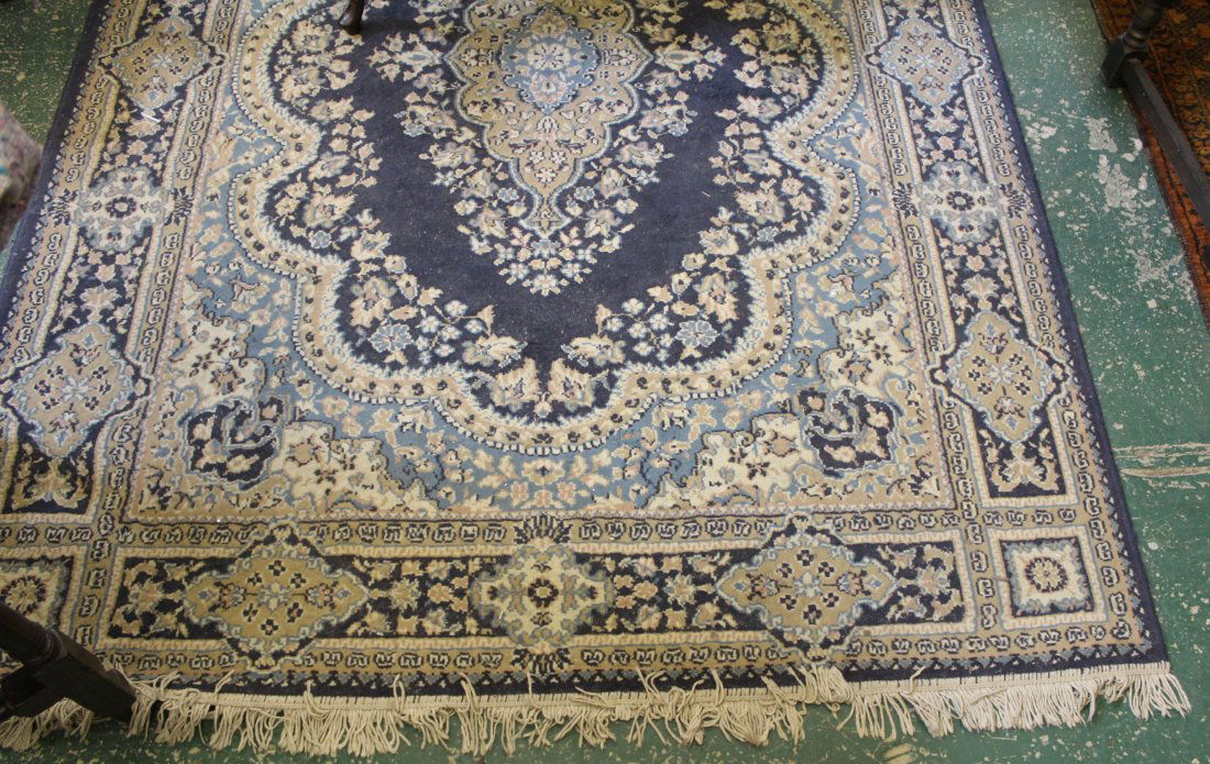 Large blue ground rug of traditional design, central (1 of 1)