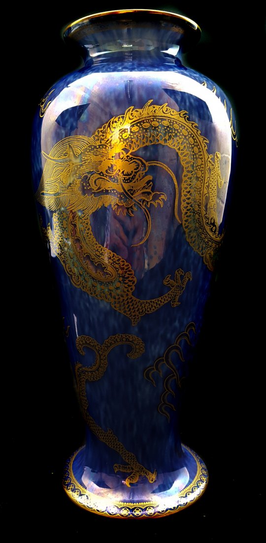 Daisy Makeig Jones for Wedgwood, a baluster form vase,: Daisy Makeig Jones for Wedgwood, a baluster form vase, gilded with scaly Chinese dragons on a wet cobalt blue ground, pattern number Z4829, gilded Portland vase mark with Wedgwood Made in England, 26c