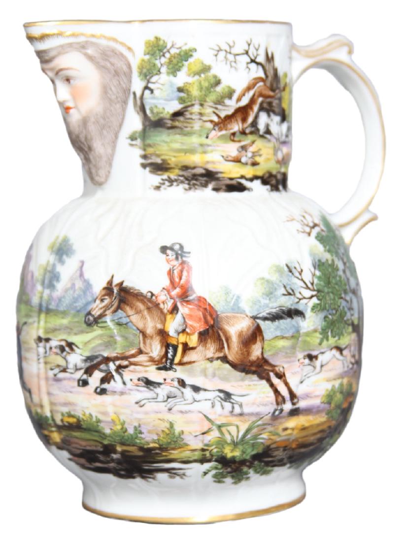 An English Mask Jug with Hunt Scene, 19th century: An English Mask Jug with Hunt Scene, 19th century Hand painted with a Hunt Scene, dogs and the spoils of the hunt. The spout decorated with a bearded mask. After a Worcester or Caughly model. Swirled 