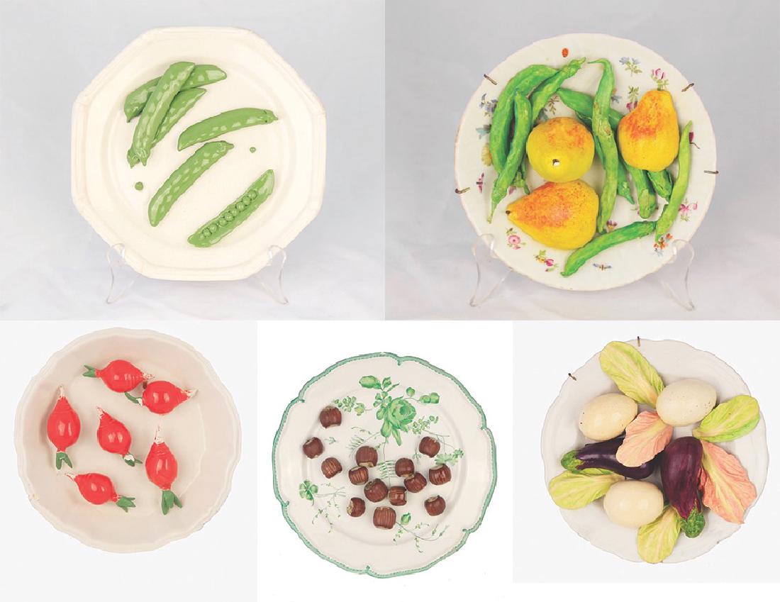 Group of Trompe l'oeil ceramic plates: Group of Trompe l'oeil ceramic plates Comprising: peas, hazelnuts, radishes, pears and eggplants Assorted sizes
