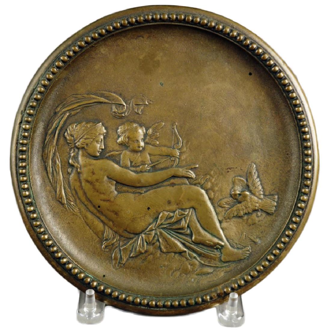 A Cast Brass Plaque depicting Venus and Cupid: A Cast Brass Plaque depicting Venus and Cupid In the form of a roundel, signed Rassler and Schopper 9 1/8 in. d.