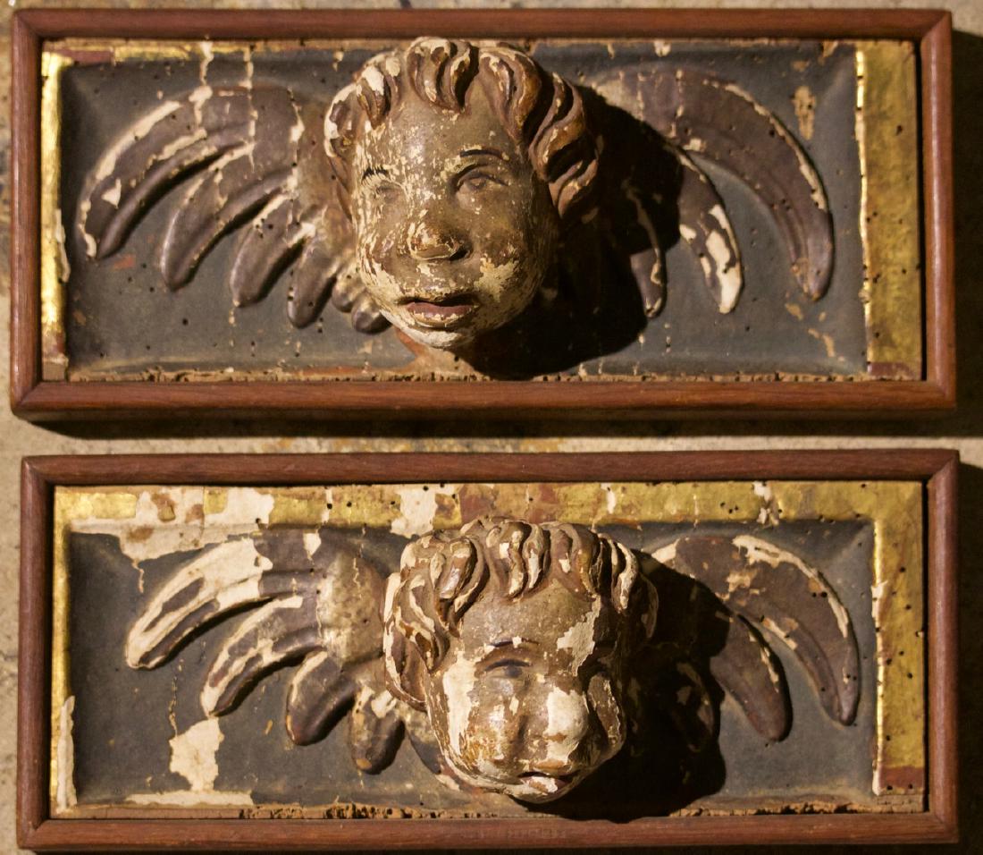 Pair of Carved Putti Bust in the Manor of Raphelle: Pair of Carved Putti Bust in the Manor of RaphelleDesigned to be hung as decoration4.25 in. h. x 9.75 in. w., each