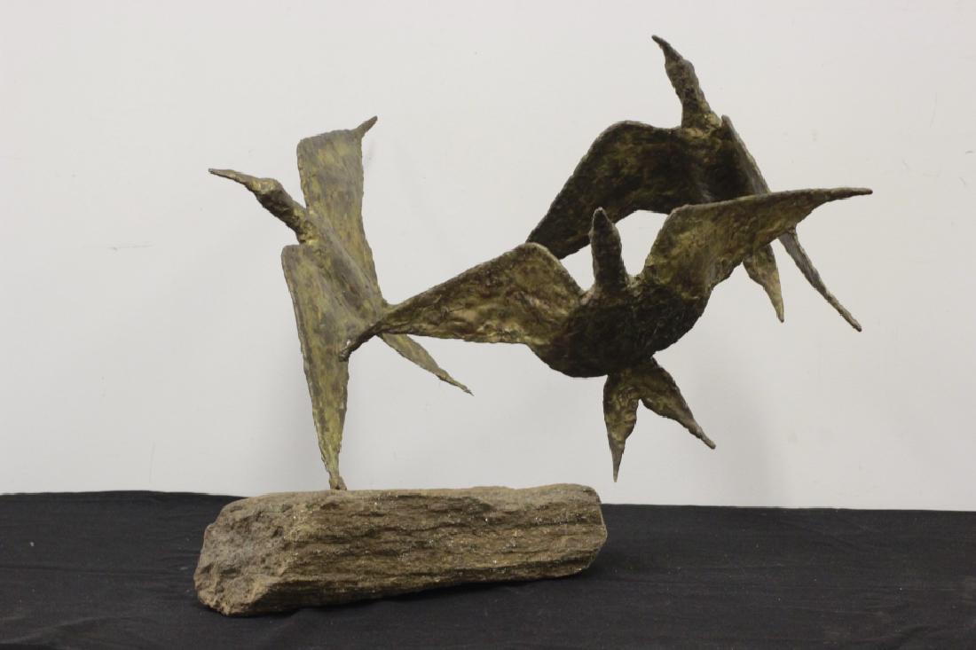 Mid Century Metal Sculpture of Birds in Flight: Large Mid Century Metal Sculpture of Birds in Flight on Hand Cut Rock Base. Attributed to Sklar. Overall Dimensions- L-26" x H-22".