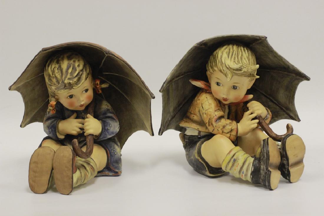 Pair of Goebel Boy & Girl Hummels w/ Umbrellas: Pair of Goebel Boy & Girl Hummels w/ Umbrellas. Dimensions- H-8".