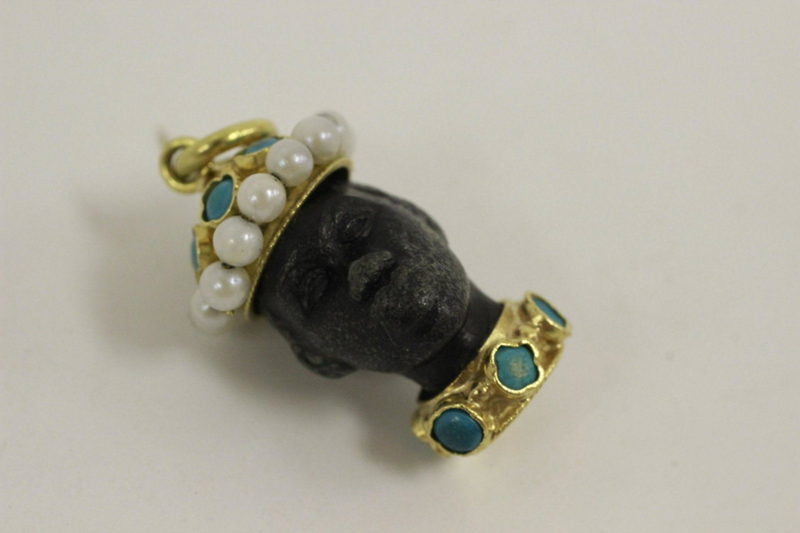 18K Gold Pearl, Turquoise & Blackamoor Charm: 18K Gold Pearl, Turquoise & Blackamoor Charm. Generally Good Condition w/ Some Rubbing to the Face. Provenance From a Northern New Jersey Estate. Dimensions- L-1". Weight- 4.8g.