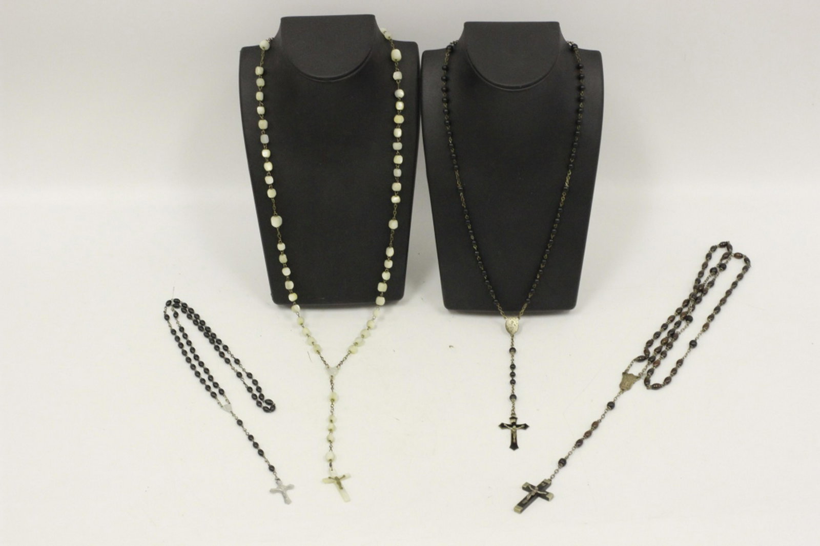 4pc Lot of Catholic Rosary Beads w/ Cross Pendants: 4pc Lot of Catholic Rosary Beads. One is Mother of Pearl. In Original Bags. Provenance from a Garden City, NY Collector. In generally good condition considering usage. Longest Dimensions- L- 36"