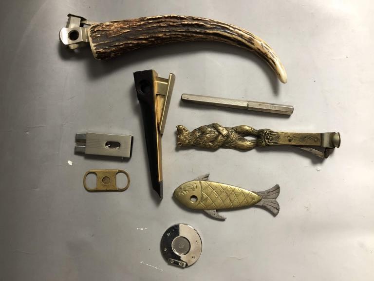 8pc Lot Cigar Cutters Including Solingen: 8pc Lot Cigar Cutters Including Solingen, Waldorf Astoria, Italy, Bronze Figural Fish & Bear, Stag Bone Handle, Smoke Chancellor Cigar Advertising Fountain Pen.