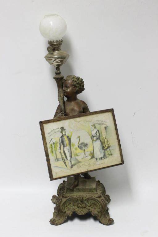 Figural Cherub Advertising Table Top Lighter (1 of 5)