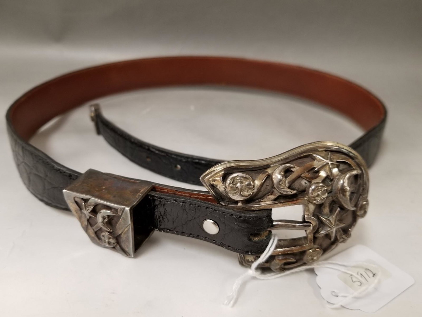 Sterling Silver Belt Buckle w/ leather Belt: Sterling Silver Belt Buckle w/ leather Belt. Fully Hallmarked by B. Kieselstein. Provenance from a Long Island, NY Home. Generally Good Condition. Dimensions- Total L-38" (Including Buckle). Total Wei