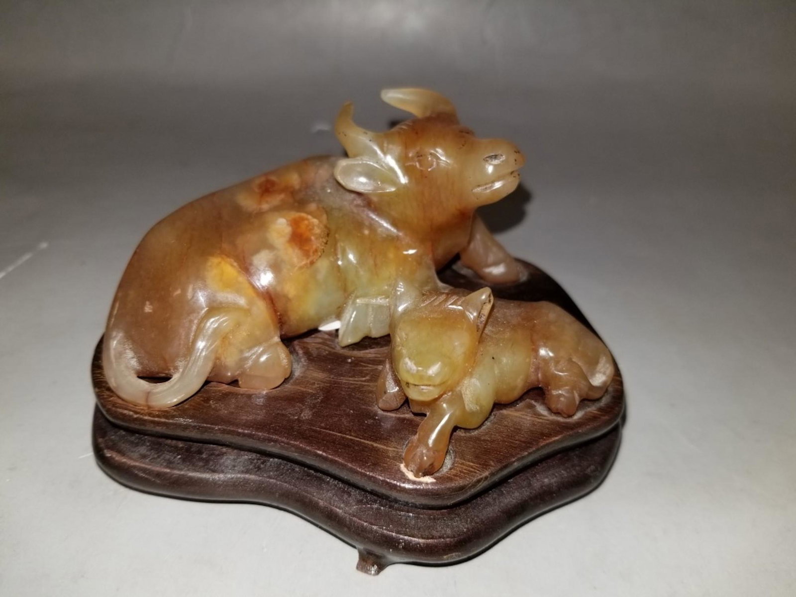 Chinese Carved Figure of Ox & Calf: Chinese Carved Figure of Ox & Calf w/ Original Wood Base. Provenance from a NY Estate. Good Condition. Dimensions- H-1.5" x W-3.25".
