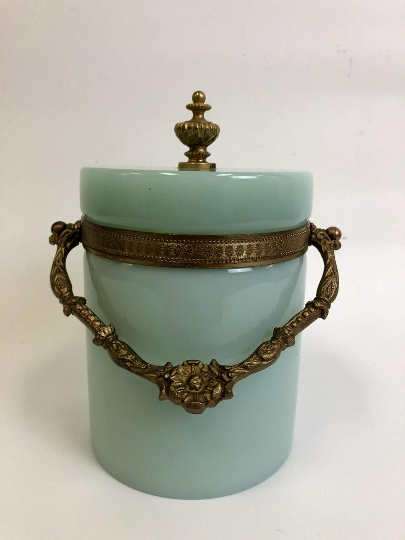 French Victorian Opaline Art Glass Biscuit Jar: French Victorian Opaline Art Glass Bronze Gilt Baccarat Style Biscuit Jar. Generally Good Condition. Provenance From a New York Estate. Dimensions- Total H- 8" x Dia-5". Please note the absence of a c