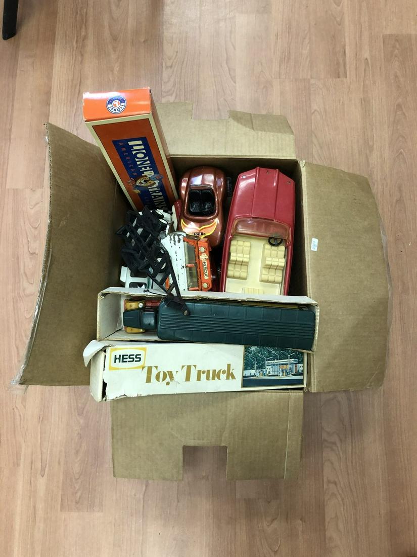 Large Lot of Vintage Toy Trucks & Train: Large Lot of Vintage Toy Trucks & Train, Including 1960's/1970's Hess Trucks, Tonka Trucks, Red Jeep, Boat & Trailer, Black Pick Up Truck, Coupe Car, Rescue Vehicle, Lionel Train, Etc. As Found. Used