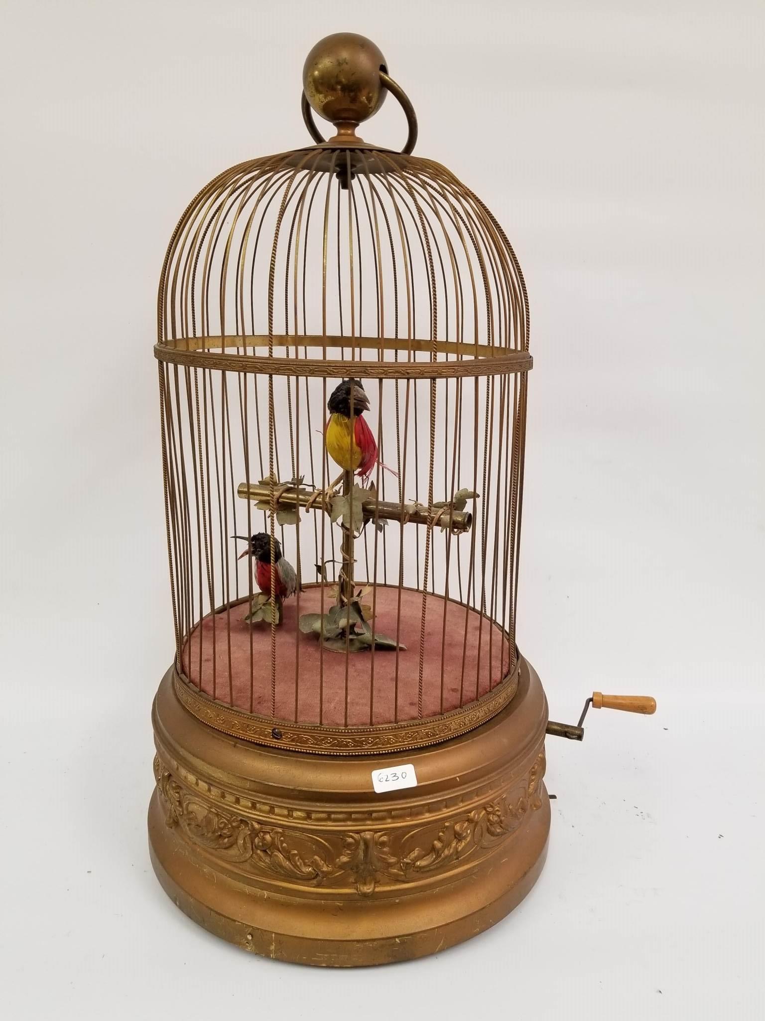 Large Singing Bird Box Bird Cage w/ 2 Birds: Large Singing Bird Box Bird Cage w/ 2 Birds & Crank Winder. Both Birds Move Beaks, Heads & Tails. Needs Some Work. Provenance From a New Jersey Estate. Dimensions- H-21". Dia-11". Please note the abse
