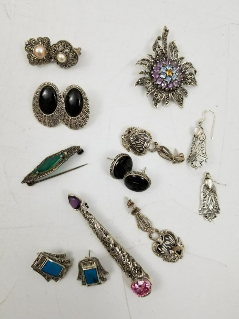 Lot of Silver Items 3 Brooches & 6 Earrings: Lot of Silver Items Including 3 Brooches, 6 Earrings w/ Malachite & Semi Precious Stones. Provenance From a Long Island, NY Home. Total Weight-88.4g. Please note the absence of a condition report does