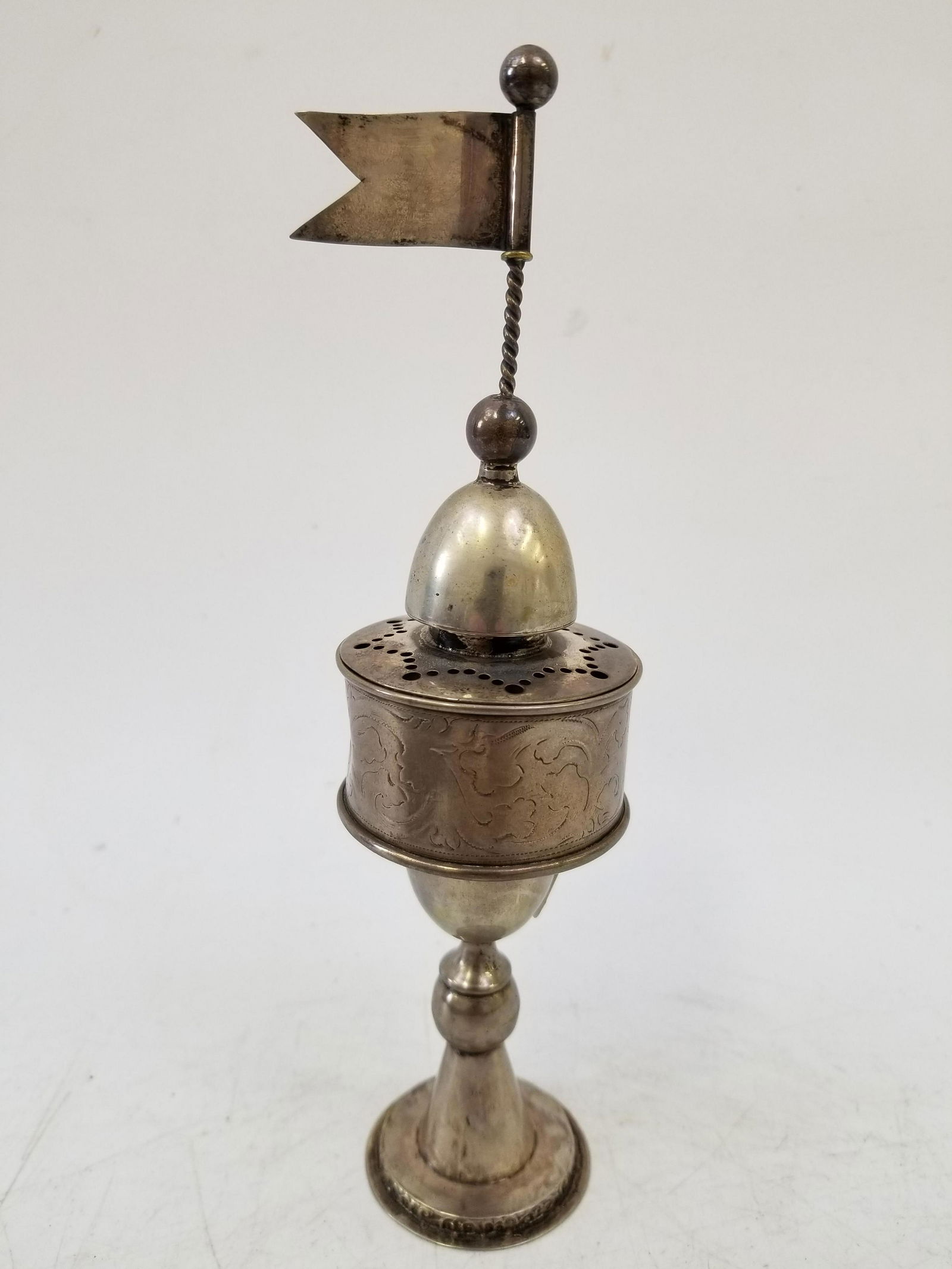 Judaica 19thC Continental Silver Besamim Spice Box: Judaica 19thC Continental Silver Besamim Spice Box. Purchased at Sotheby's Tel Aviv in 1989, Lot 595. Comes with Original Sothebey's Catalogue. Has a Dent on the Circular Middle Part. Provenance From