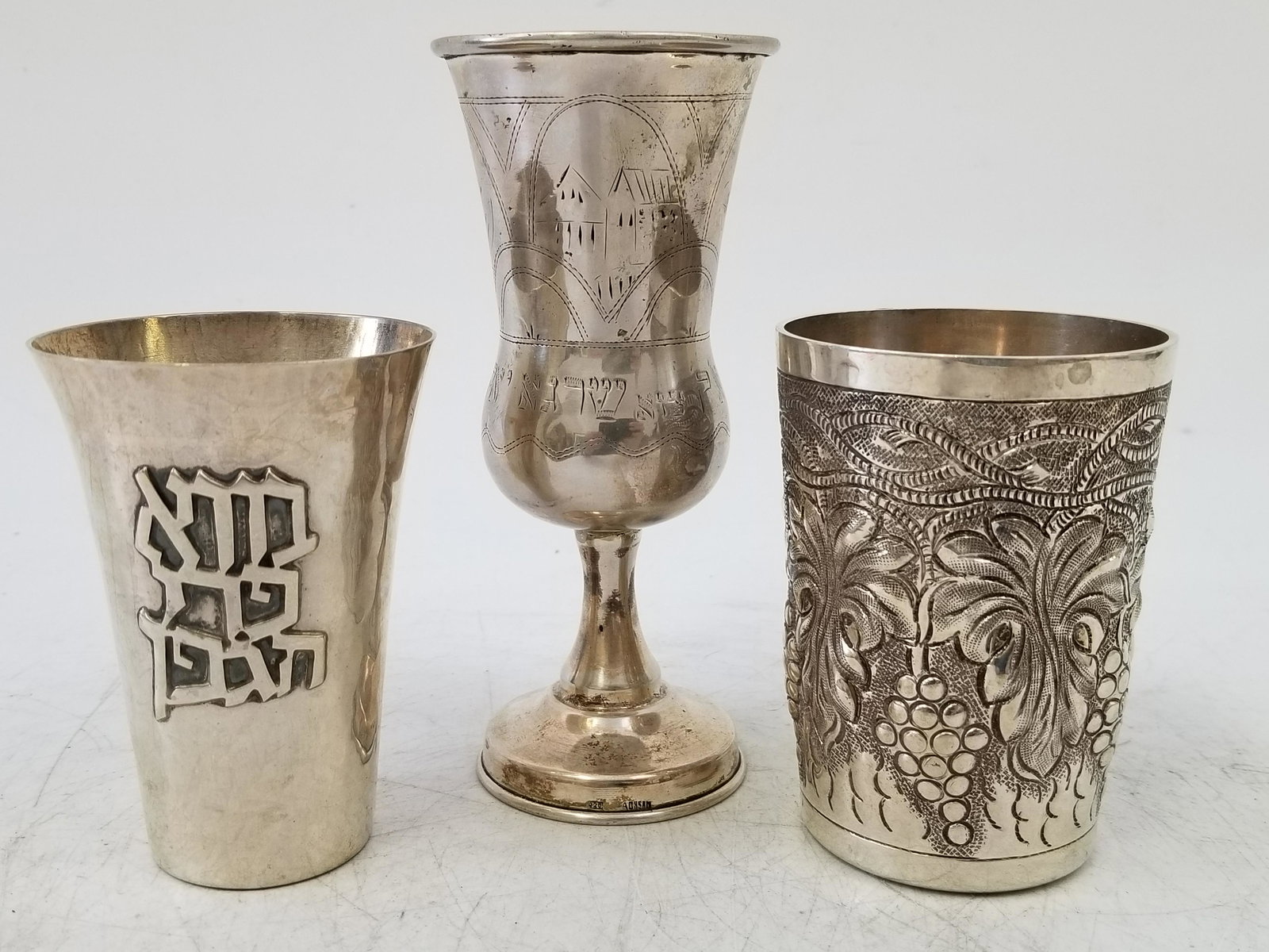 3 Judaica Sterling & 925 Silver Kiddish cups: 3 Judaica Sterling Silver and 925 Silver Kiddish cups. 1 Sterling by Grand ( Hand chased), the other by Bier Israel 925, and another. Dimensions: Tallest: H 5.25" Total Weight: 9.87 Ozt, 307 gr. Prove