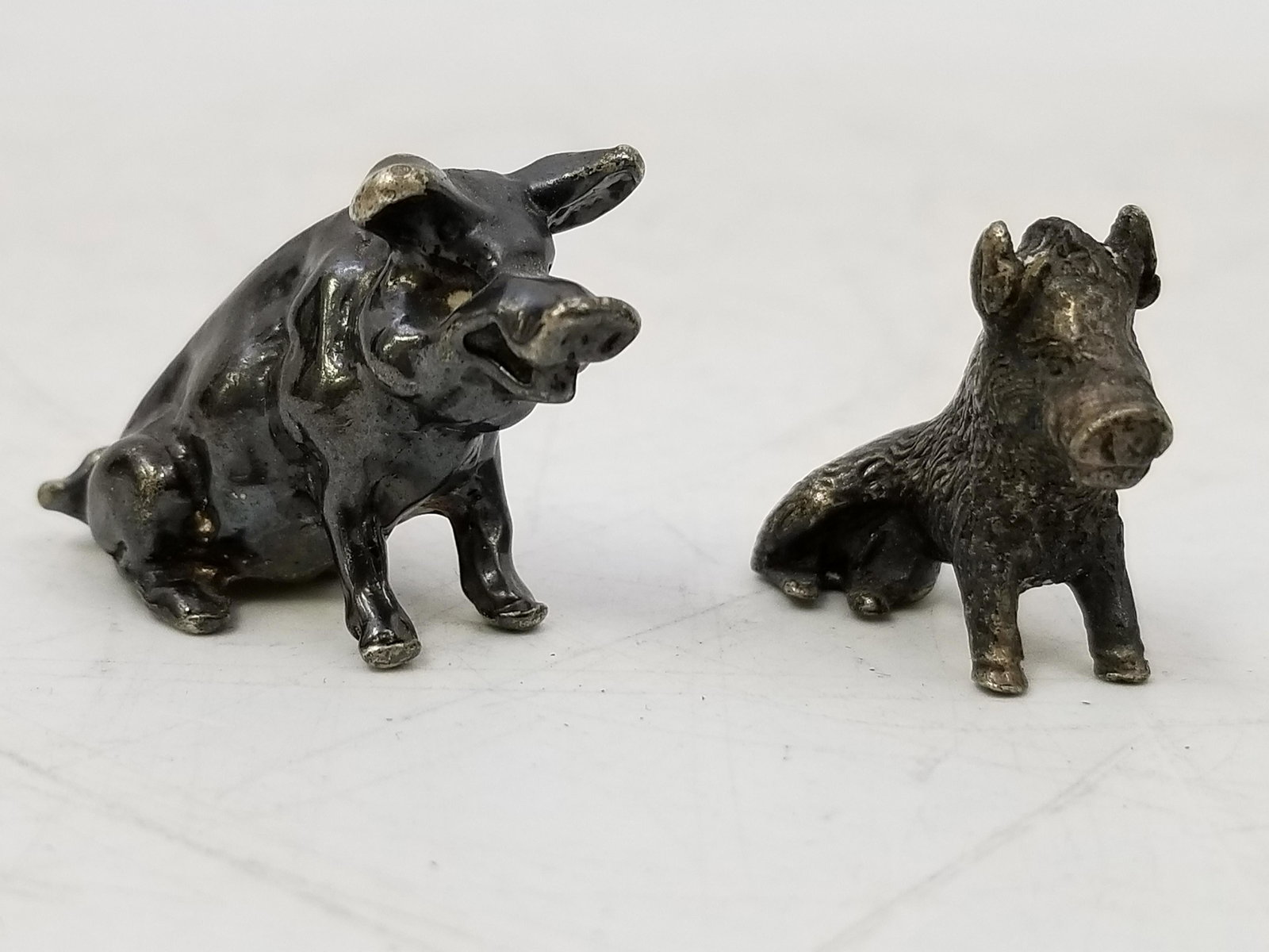 2 Miniature 800 Silver Figures of animals: 2 Miniature 800 Silver Figures of animals. One is Hallmarked. Both in good condition. Dimensions: Larger L 1.5", H 1" Weight: 1.62 Ozt, 50 gr. Provenance: From a Long Island Estate. Please note the ab