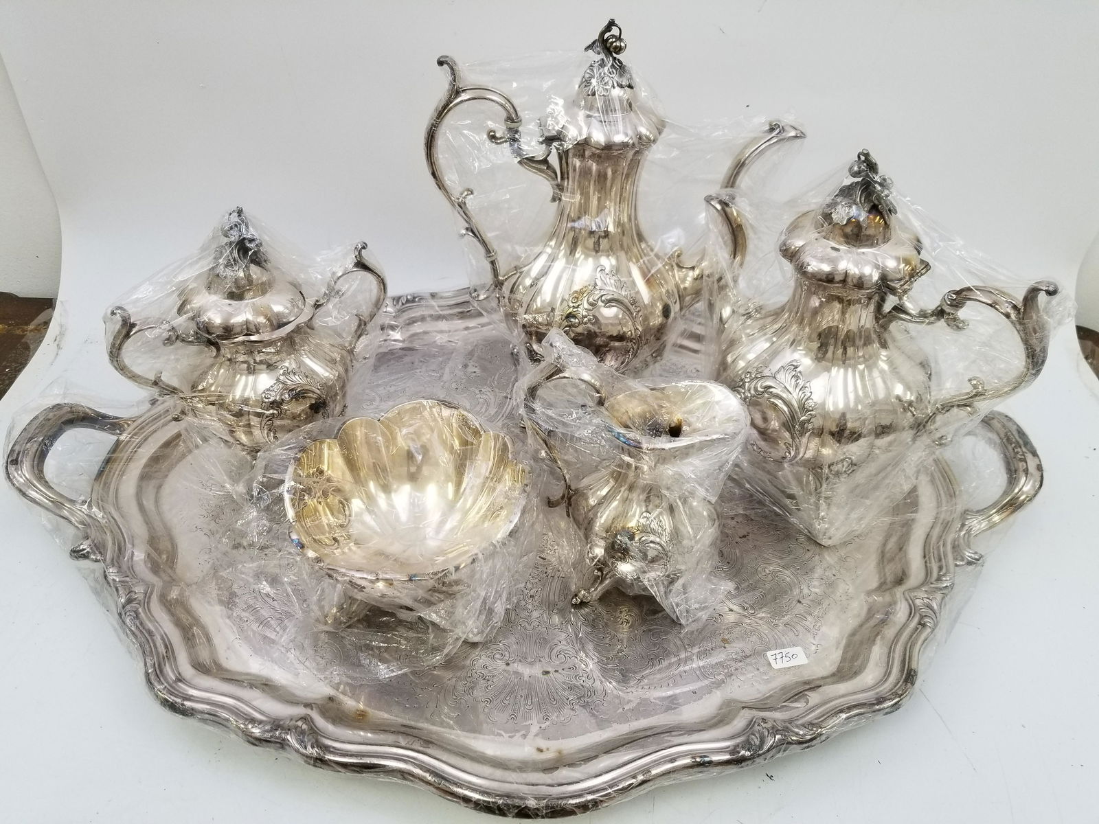 6 Piece Silver Plate Tea and Coffee set with Tray: 6 Piece Silver Plate Tea and Coffee set with Tray " Winthrop Shield" Provenance: From a Long Island Home. Please note the absence of a condition report does not imply that there are no condition issue